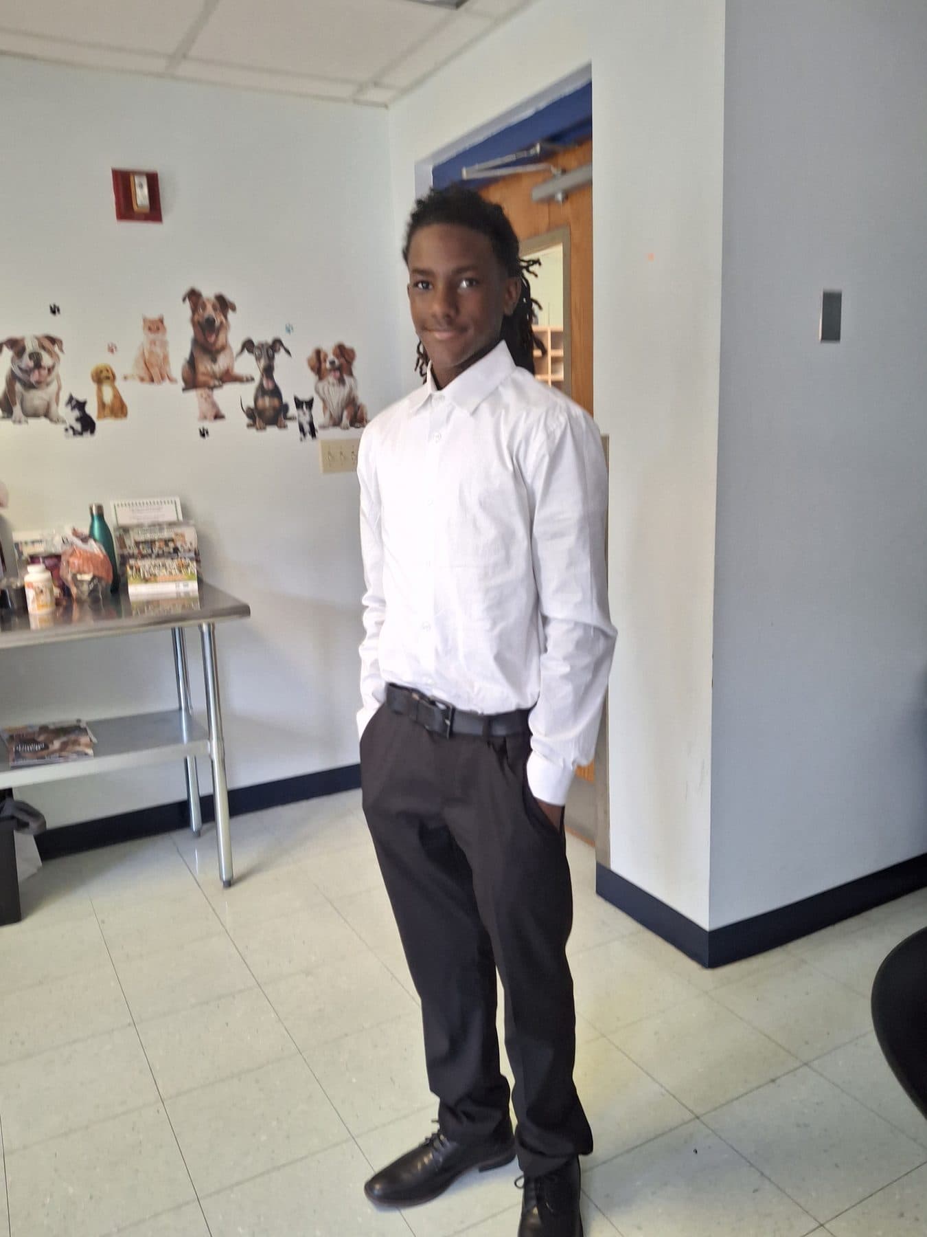A Work-Based Learning participant in professional dress at a host-business worksite